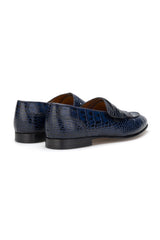 Loafer displayed on a wooden surface, emphasizing its matte finish