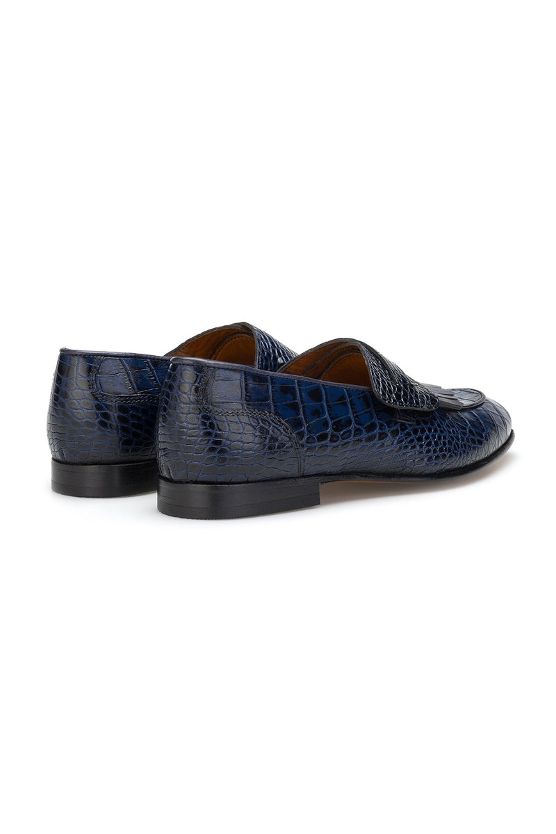 Loafer displayed on a wooden surface, emphasizing its matte finish