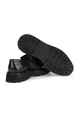 Lifestyle image of the loafer worn on a man's foot, ready for business attire.