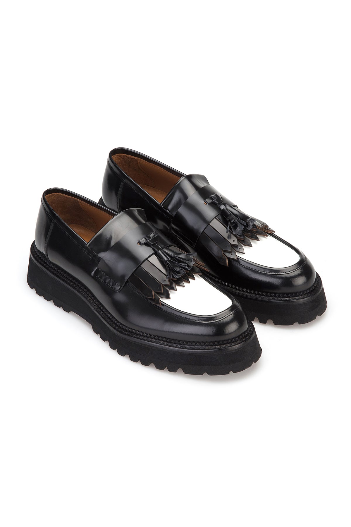 Front view of black leather loafer with glossy finish, showing the profile sole.