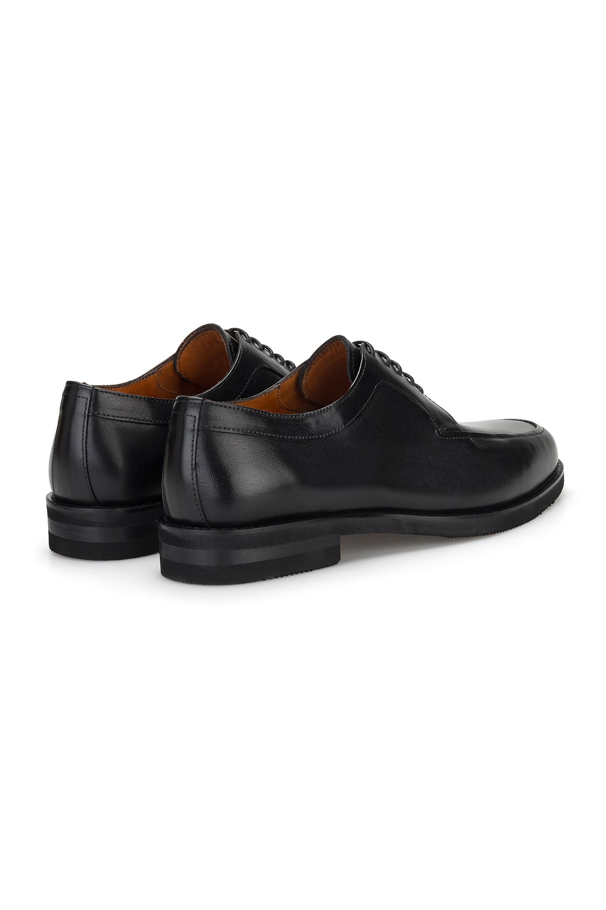 Side angle of the shoe displaying the 3 cm heel and rounded toe in a sleek black finish.