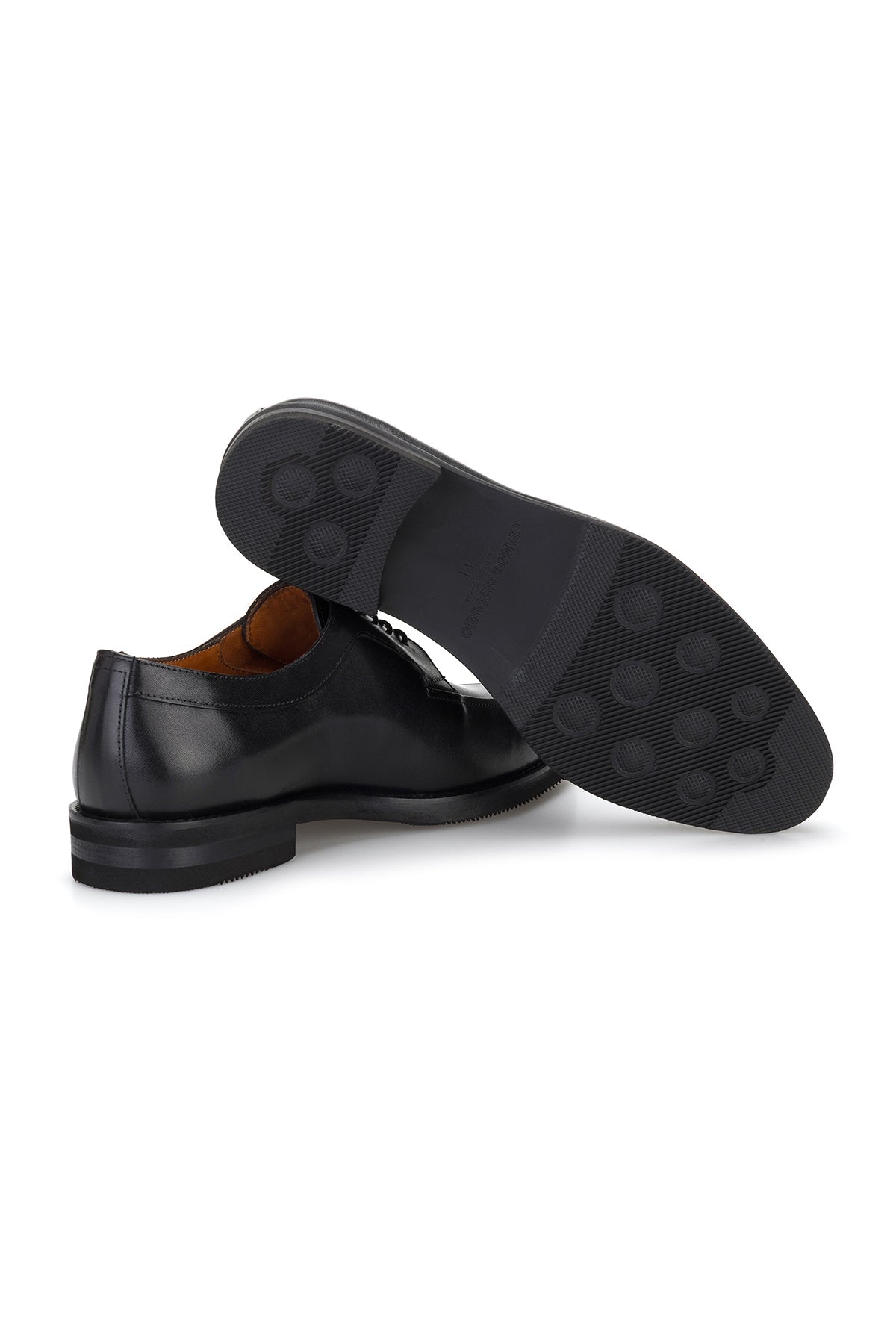 Business professional walking confidently in the black Gianni & Armando shoe, exuding understated elegance.