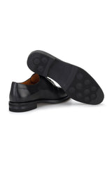 Business professional walking confidently in the black Gianni & Armando shoe, exuding understated elegance.